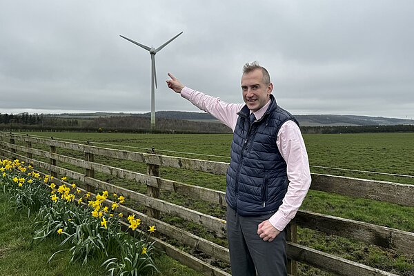 Aidan at a windfarm